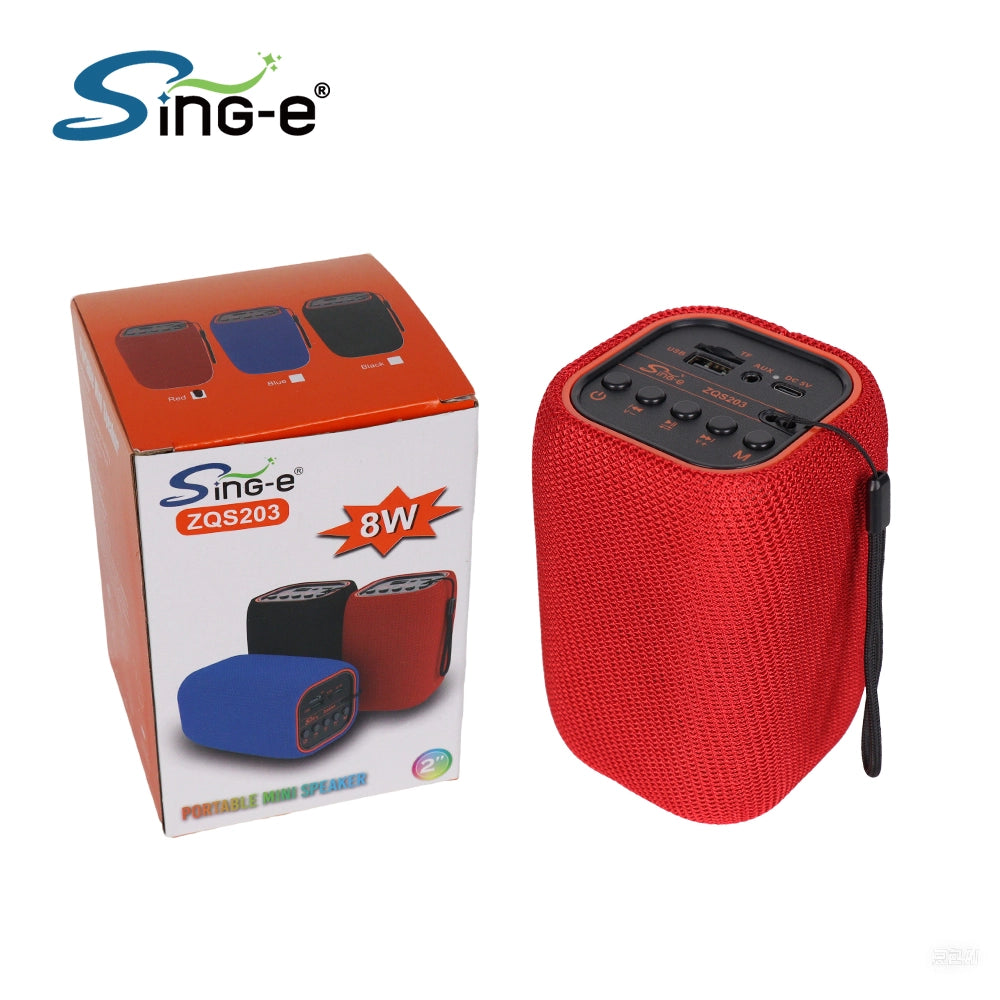 Sing-e ZQS203, a compact portable mini wireless Bluetooth speaker featuring a textured mesh body and an integrated carry strap.